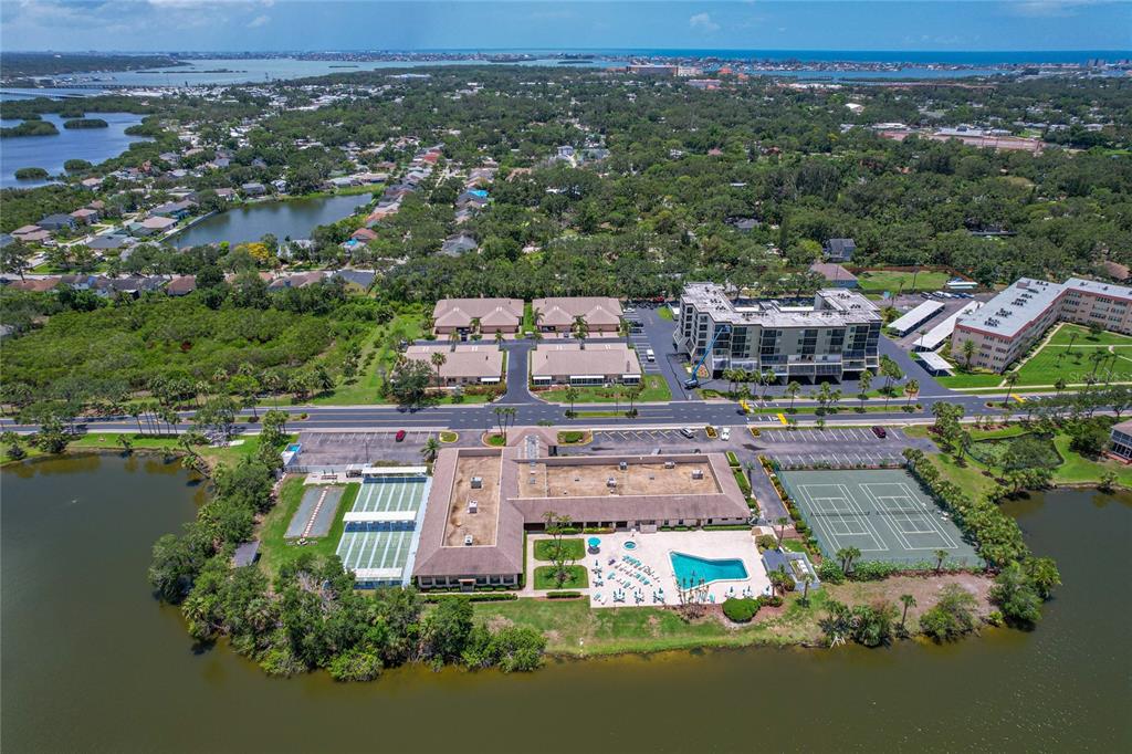 9860 62nd Avenue North, Unit 1047 St. Petersburg, FL 33708 - Photo 15 of 34 an aerial view of a house with a lake view