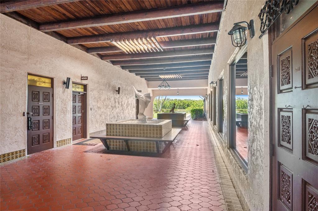 9860 62nd Avenue North, Unit 1047 St. Petersburg, FL 33708 - Photo 20 of 34 a living room with furniture and a large window
