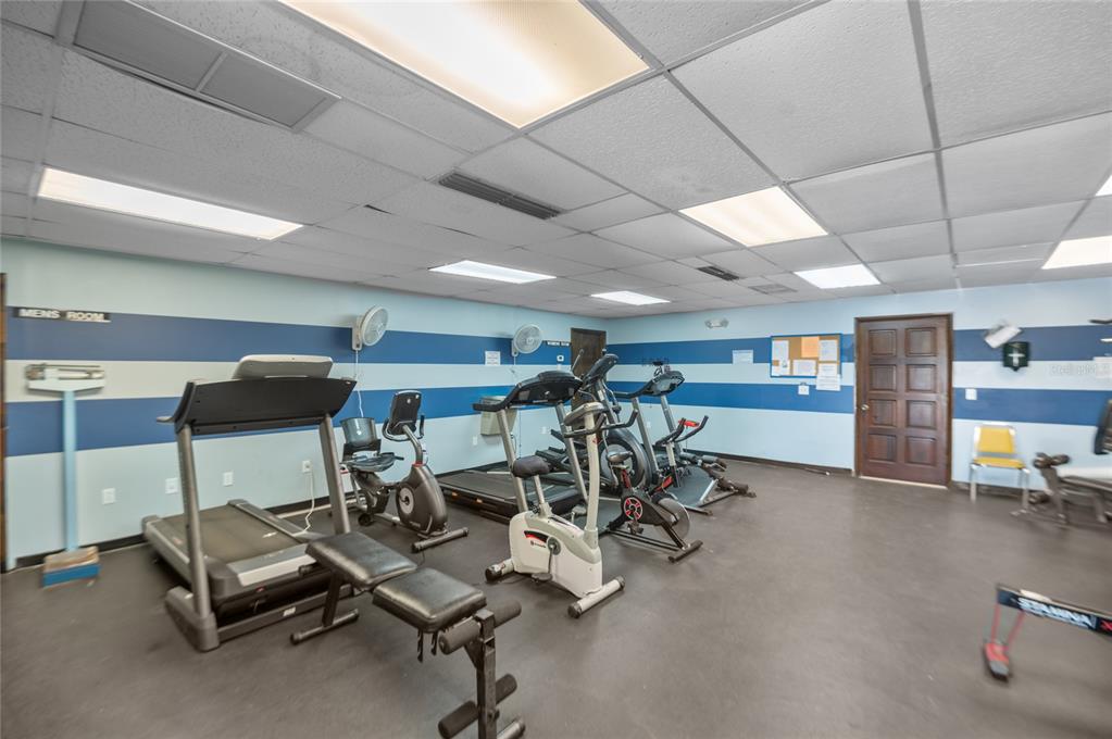 9860 62nd Avenue North, Unit 1047 St. Petersburg, FL 33708 - Photo 24 of 34 a view of a room with gym equipment