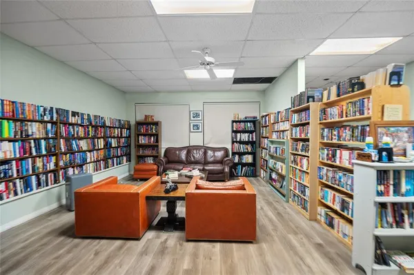 a room with furniture and book shelf
