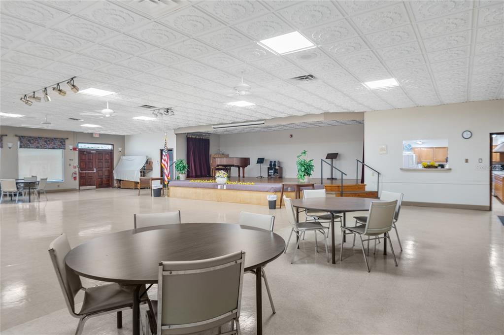 9860 62nd Avenue North, Unit 1047 St. Petersburg, FL 33708 - Photo 32 of 34 a view of a dining room with furniture and wooden floor