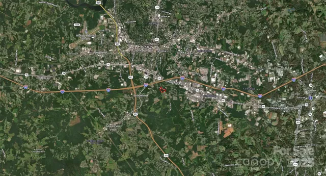 an aerial view of a houses with street