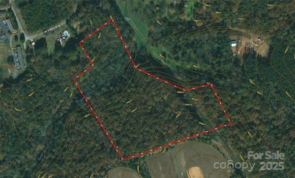 a white house with a shower and a shower curtain