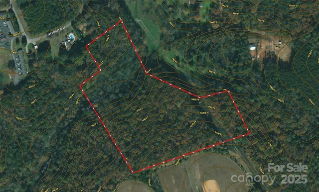 a white house with a shower and a shower curtain