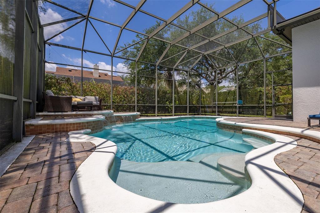 8351 Bowden Way Windermere, FL 34786 - Photo 45 of 71 a view of a swimming pool with a patio