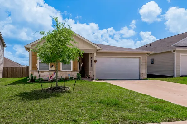 a view of kitchen with stainless steel appliances refrigerator stove microwave and cabinets