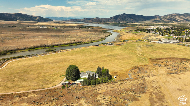 750 South Big Road Soda Springs, ID 83276 - Photo 5 of 40 Expansive land parcel featuring a single-family residence, mature trees, and a distant river