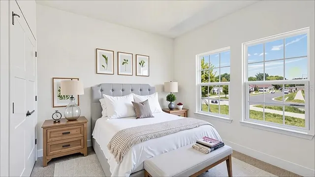 a bedroom with a bed and a window