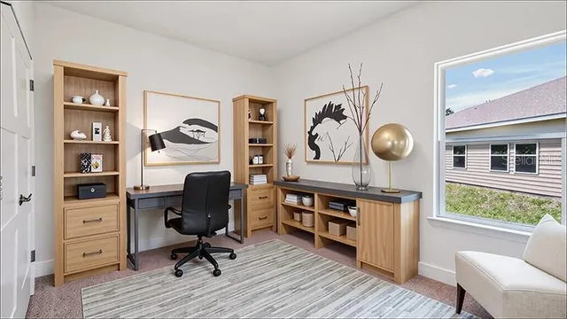 a view of a workspace with furniture and wooden floor