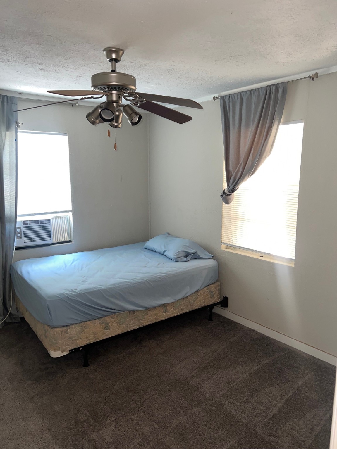 400 Carson Roberson Road Livingston, TX 77351 - Photo 6 of 10 a bedroom with a bed and window