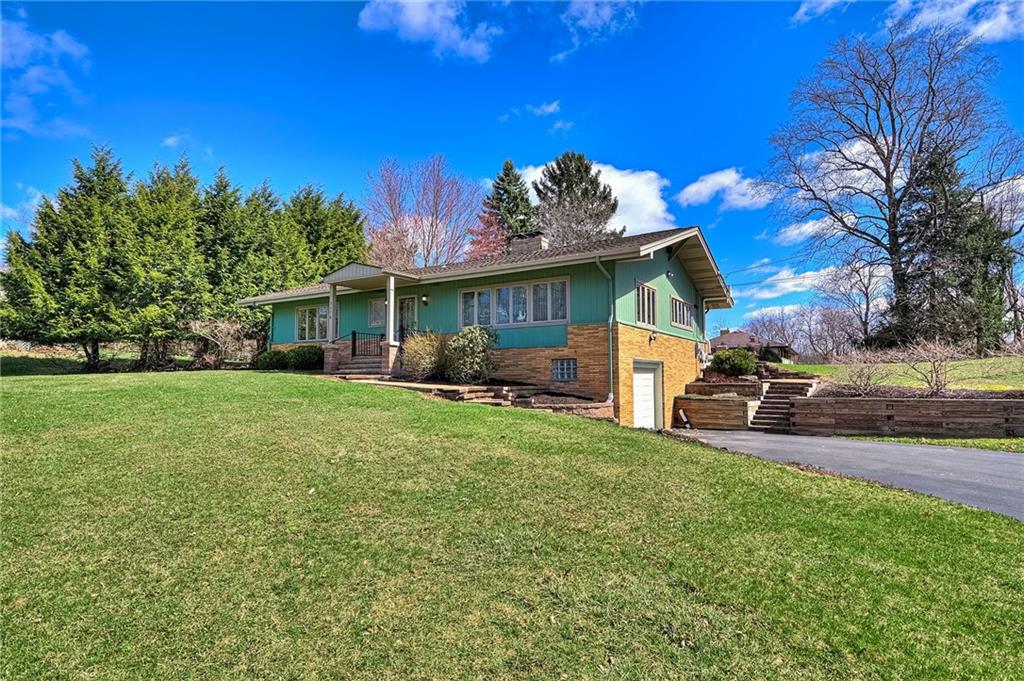 9376 Woodcrest Road Pittsburgh, PA 15237 - Photo 2 of 24 A charming setting with mature trees and immense curb appeal. Contemporary and state of the art updates inside and out ~ WiiMote controlled thermostat and lights at door & driveway!