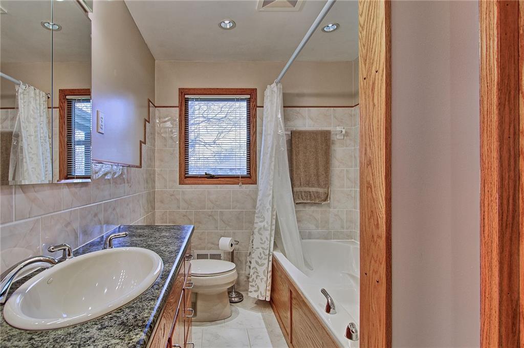 9376 Woodcrest Road Pittsburgh, PA 15237 - Photo 14 of 24 Family bath is equipped with an extra wide bath tub and ceramic tile.