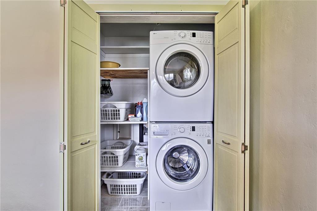 9376 Woodcrest Road Pittsburgh, PA 15237 - Photo 16 of 24 Laundry is conveniently located on the main floor and tucked in the closet of bedroom #2. It can also be relocated to the lower level near the utility sink and storage area.
