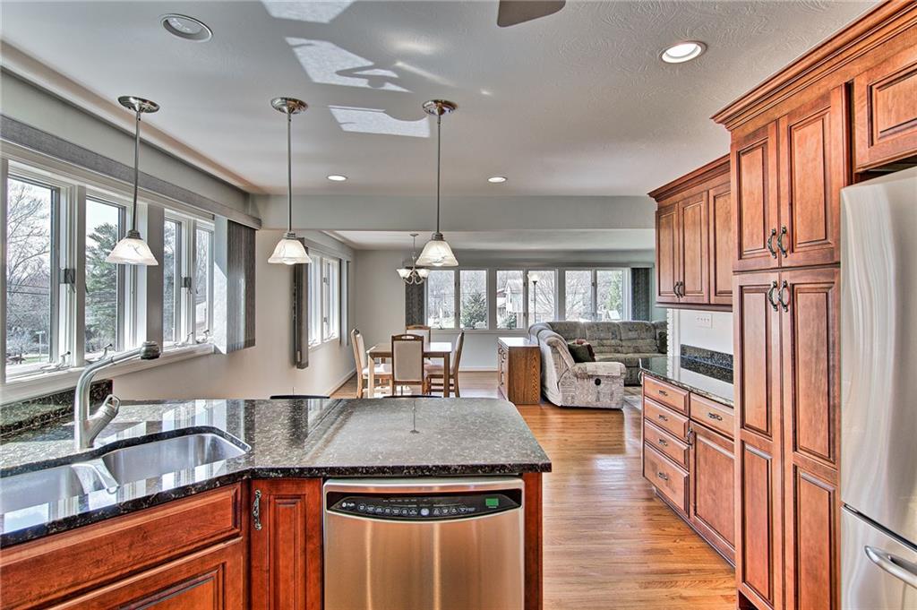 9376 Woodcrest Road Pittsburgh, PA 15237 - Photo 8 of 24 Another view showcasing the open floor plan, Andersen windows, and plentiful KraftMaid cabinets! Space in this kitchen has been thoughtfully allocated!