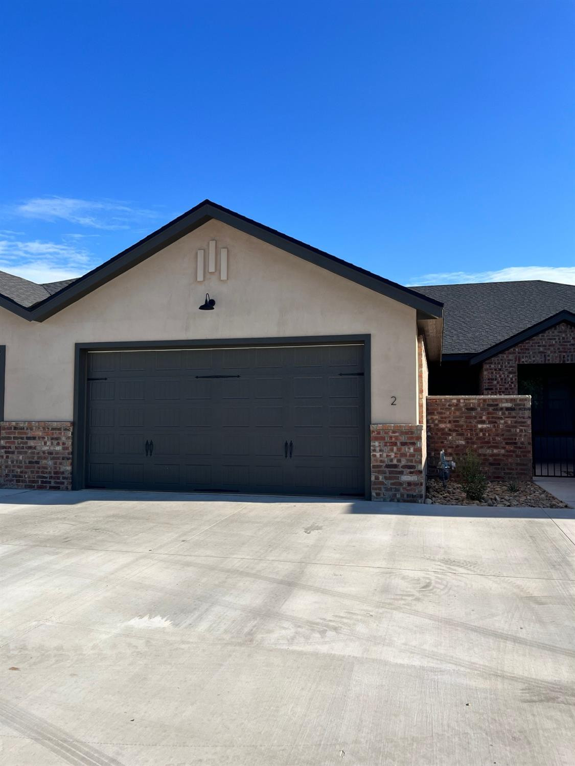 a front view of a house with garage