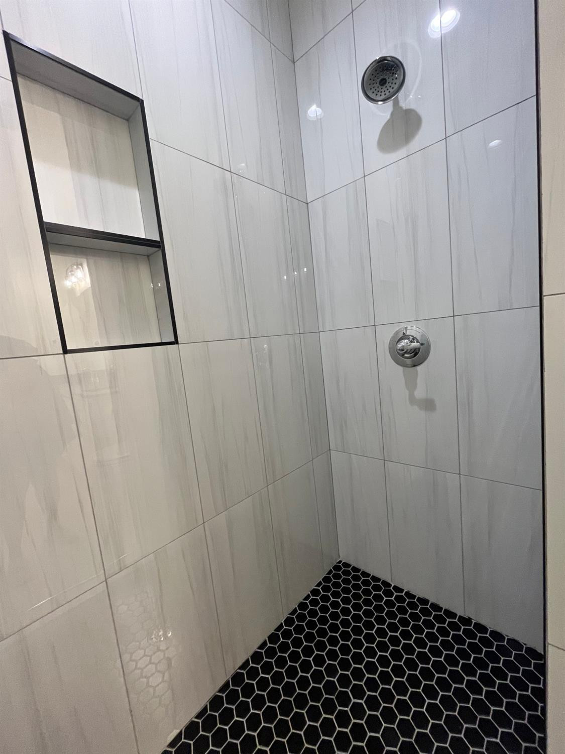 5102 58th Street, Unit 2 Lubbock, TX 79414 - Photo 11 of 18 a view of a bathroom