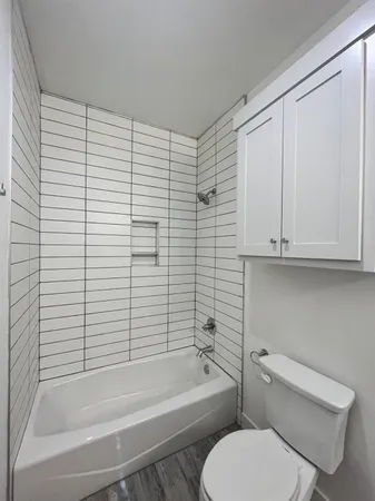 a view of room with wooden floor