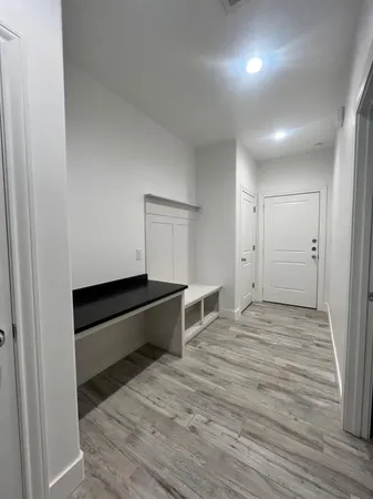 a kitchen with granite countertop a sink and a stove
