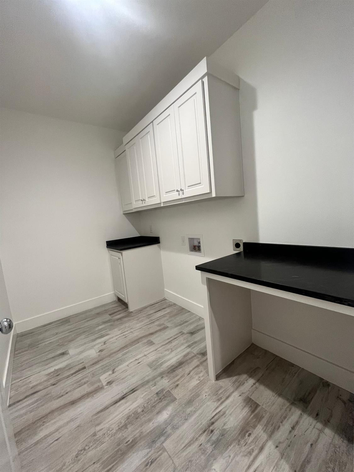 5102 58th Street, Unit 2 Lubbock, TX 79414 - Photo 16 of 18 a kitchen with granite countertop a sink and a stove