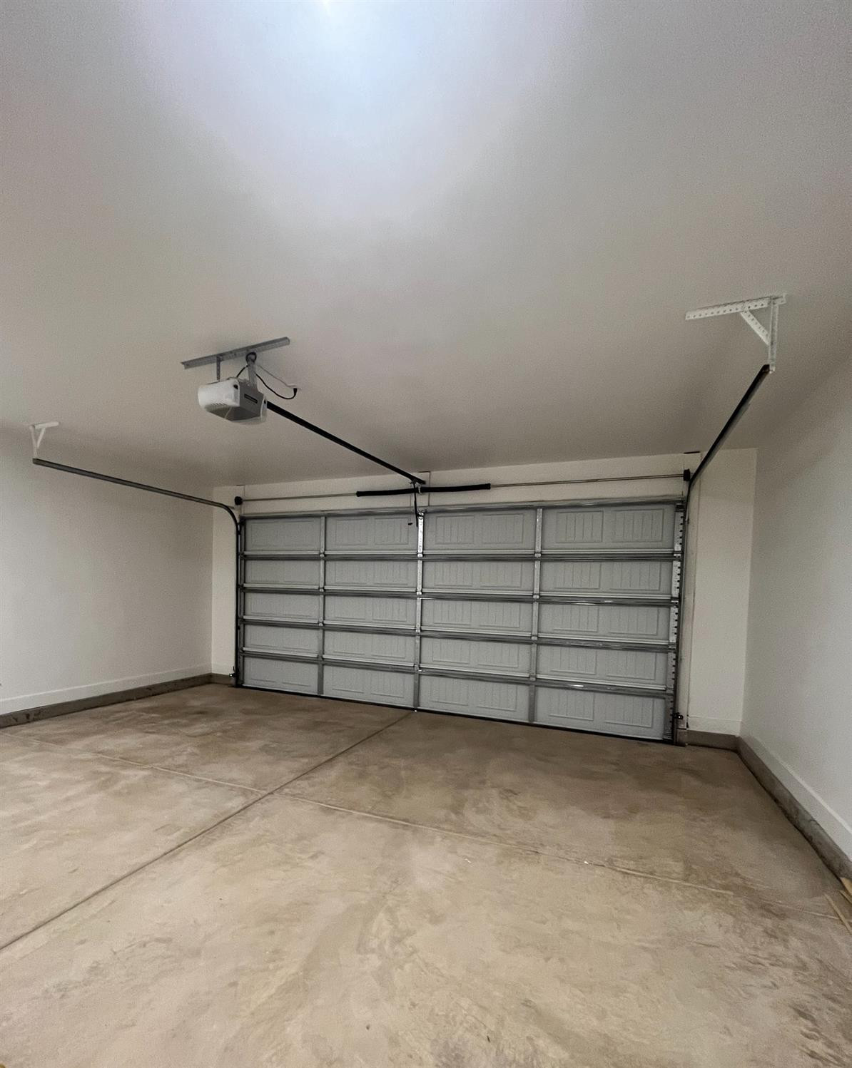 5102 58th Street, Unit 2 Lubbock, TX 79414 - Photo 18 of 18 a view of a room with stairs and white walls
