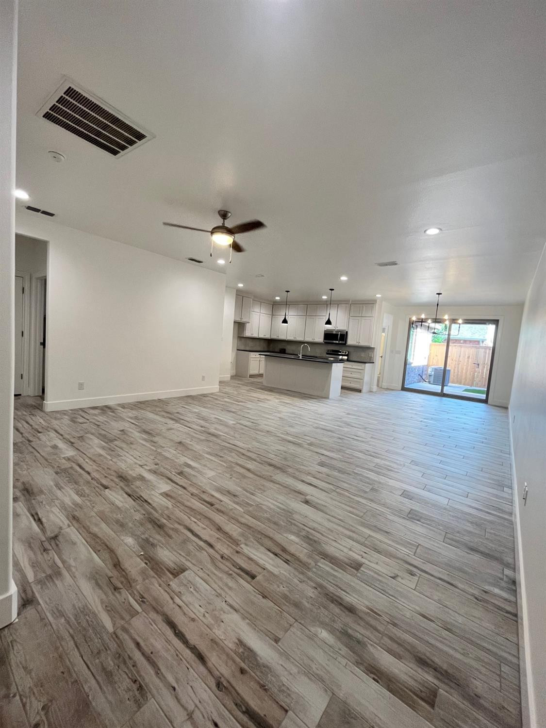 5102 58th Street, Unit 2 Lubbock, TX 79414 - Photo 3 of 18 a view of empty room with wooden floor