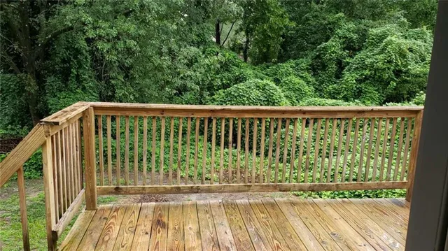 a view of balcony with wooden floor