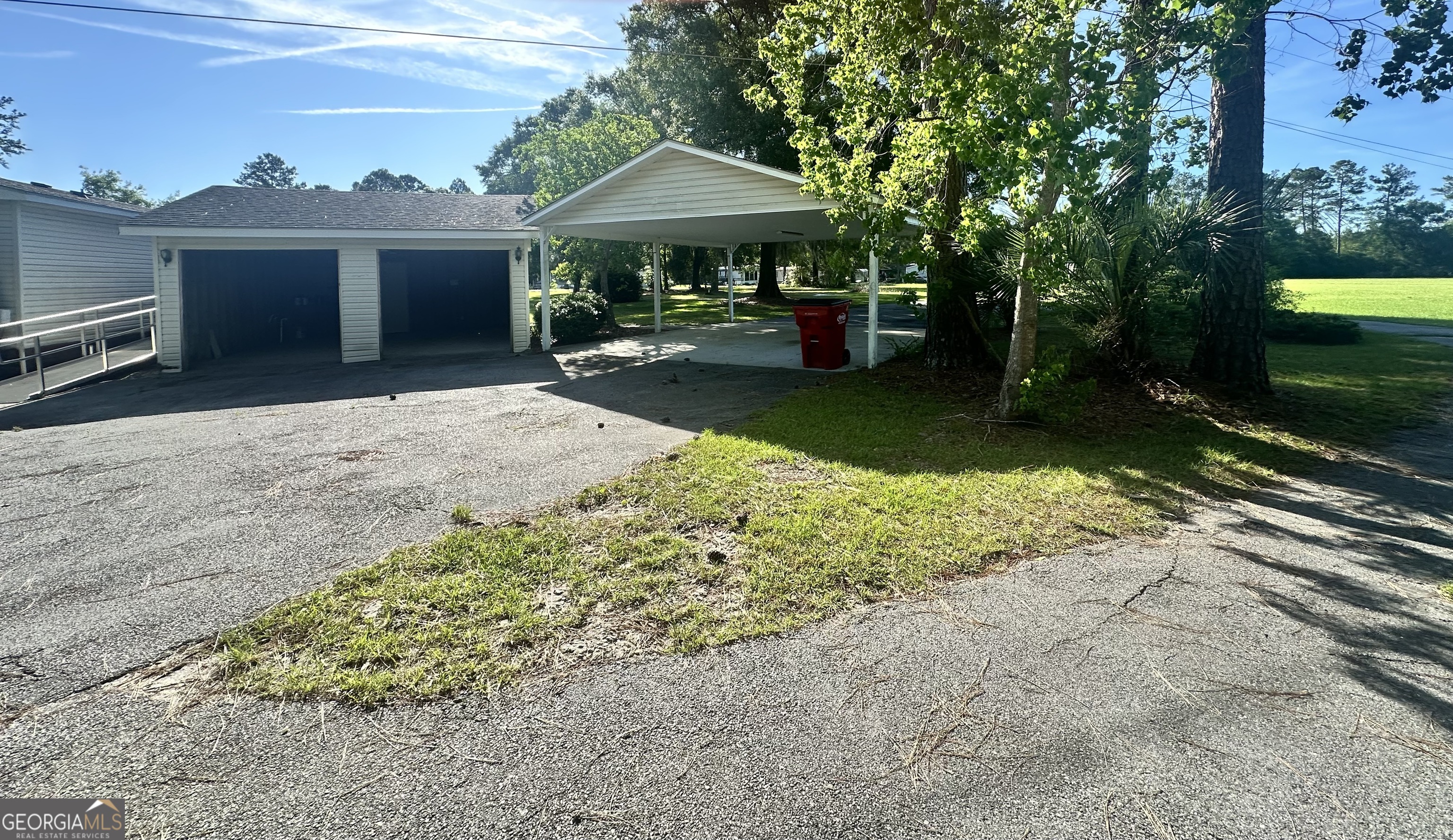 6498 Central Avenue Waycross, GA 31503 - Photo 13 of 20 a front view of a house with a yard