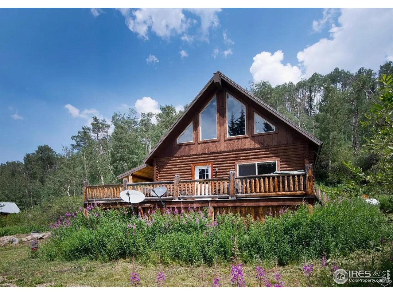 320 Mill Road Eagle, CO 81631 - Photo 1 of 32 a house with trees in the background
