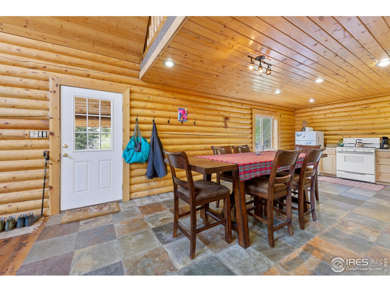 320 Mill Road Eagle, CO 81631 - Photo 13 of 32 a dining room with furniture and wooden floor