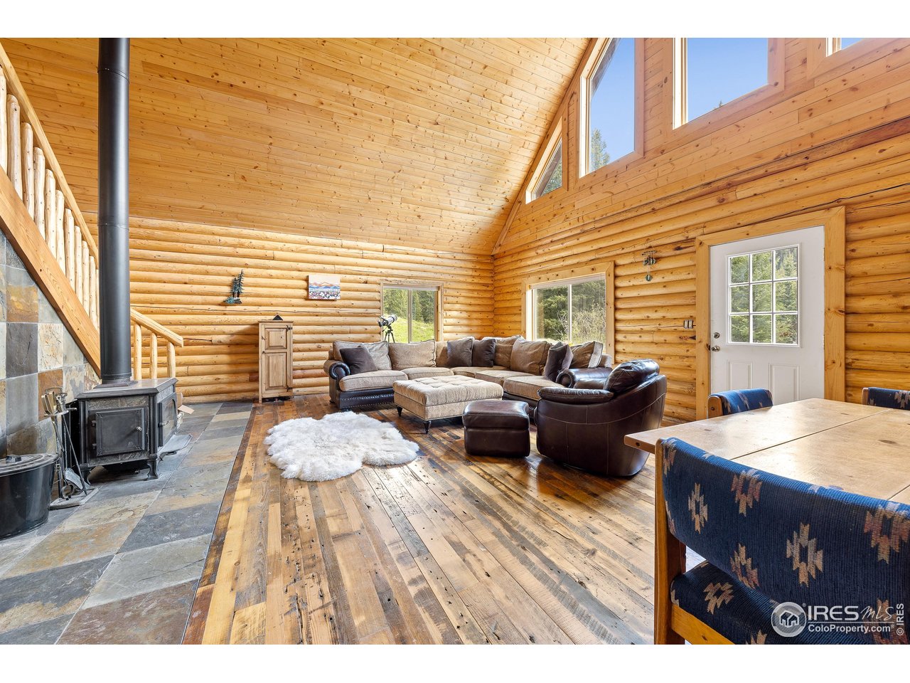 320 Mill Road Eagle, CO 81631 - Photo 15 of 32 a view of a patio with dining table and chairs with wooden floor
