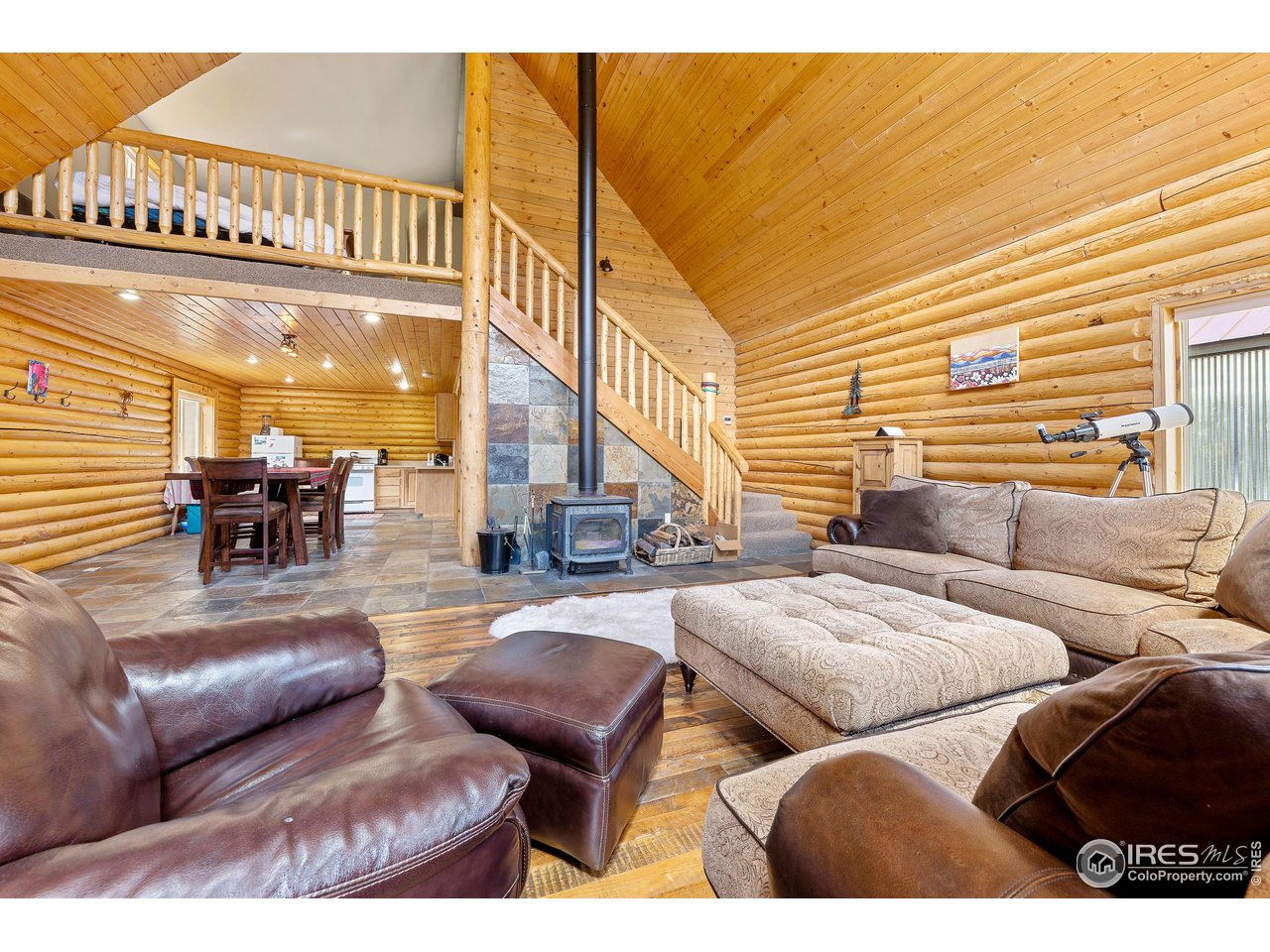 320 Mill Road Eagle, CO 81631 - Photo 16 of 32 a living room with furniture and a floor to ceiling window