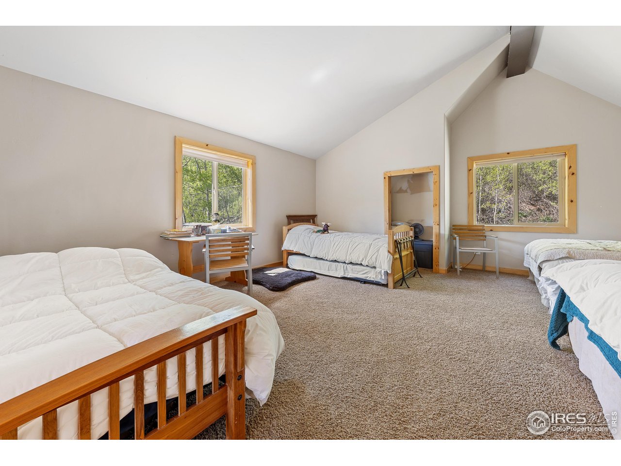 320 Mill Road Eagle, CO 81631 - Photo 18 of 32 a bedroom with two beds and a large window