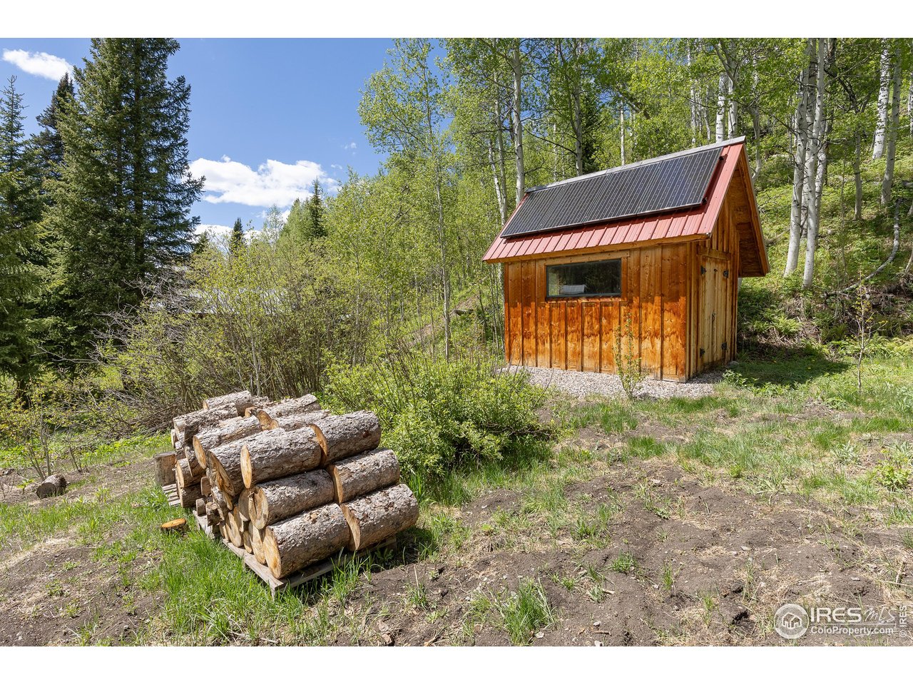 320 Mill Road Eagle, CO 81631 - Photo 22 of 32 a backyard of a house with table and chairs