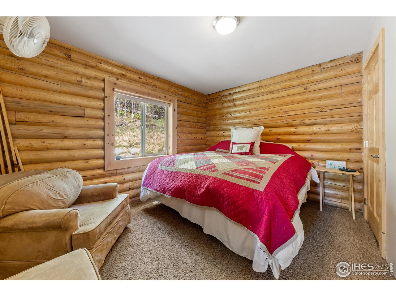 320 Mill Road Eagle, CO 81631 - Photo 8 of 32 a bedroom with a bed next to a window