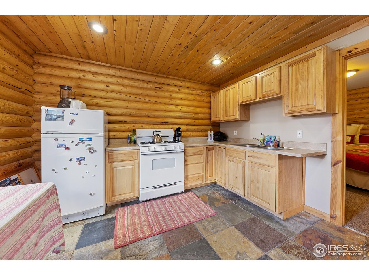 320 Mill Road Eagle, CO 81631 - Photo 9 of 32 a kitchen with cabinets wooden floor and a sink