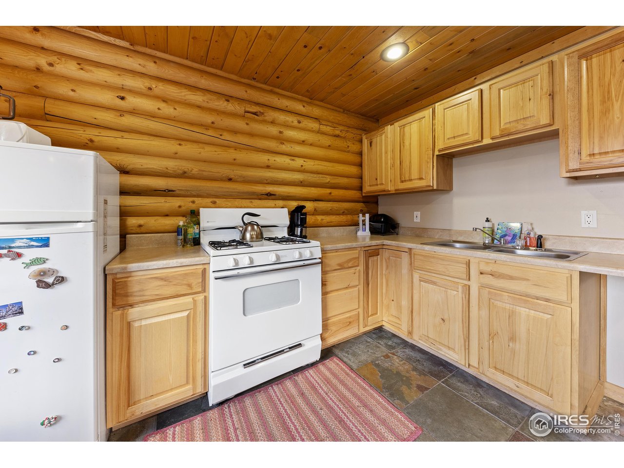 320 Mill Road Eagle, CO 81631 - Photo 10 of 32 a kitchen with cabinets appliances and wooden floor