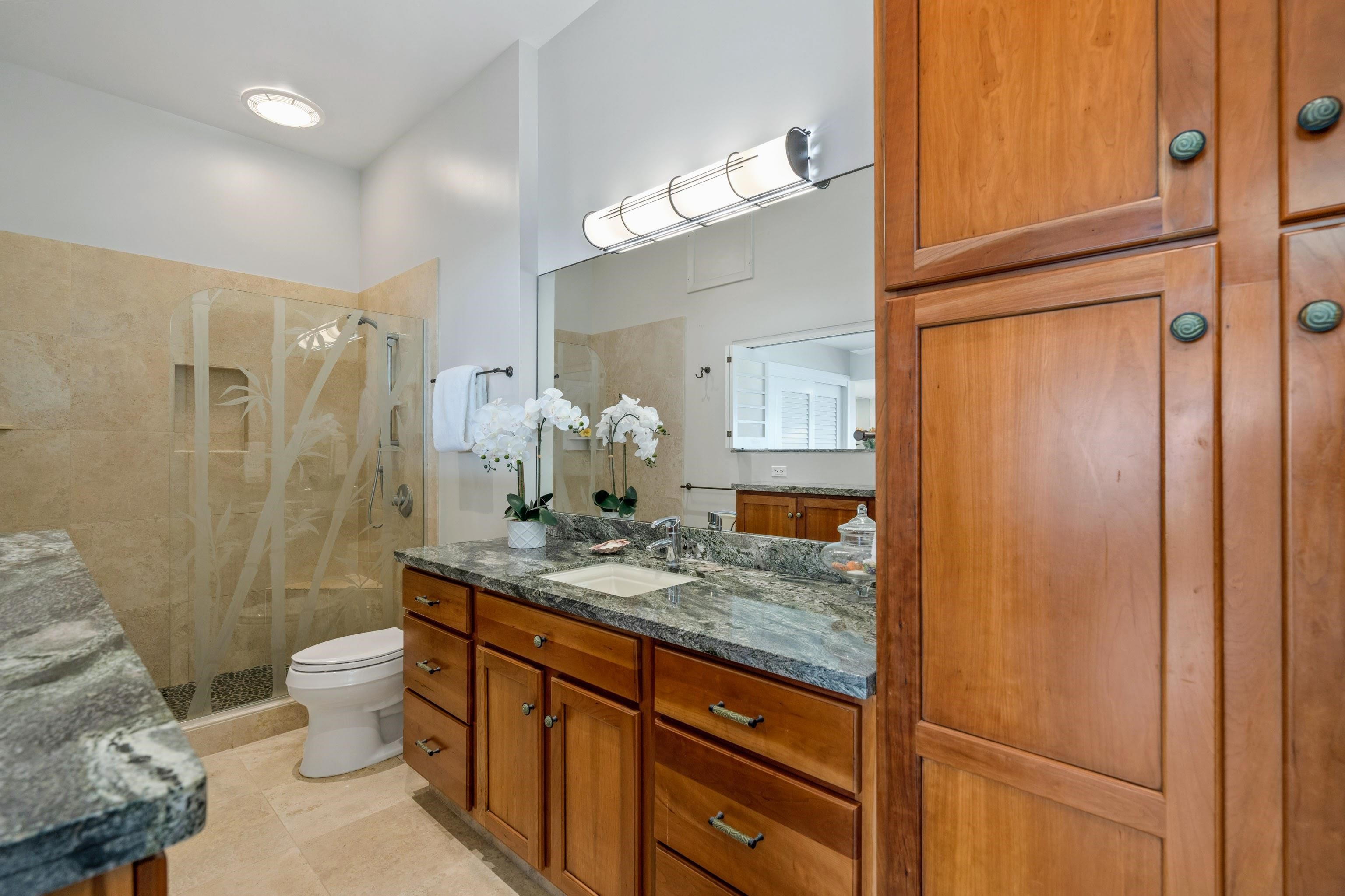 20 Hui Road East, Unit 30 Lahaina, HI 96761 - Photo 17 of 25 a bathroom with a granite countertop sink toilet and shower