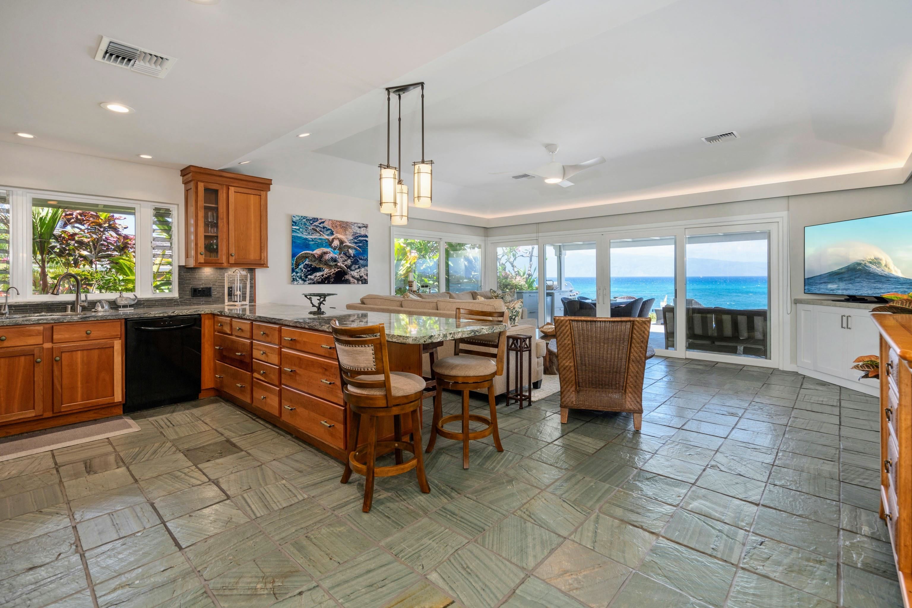 20 Hui Road East, Unit 30 Lahaina, HI 96761 - Photo 3 of 25 a room with stainless steel appliances kitchen island granite countertop a sink and cabinets