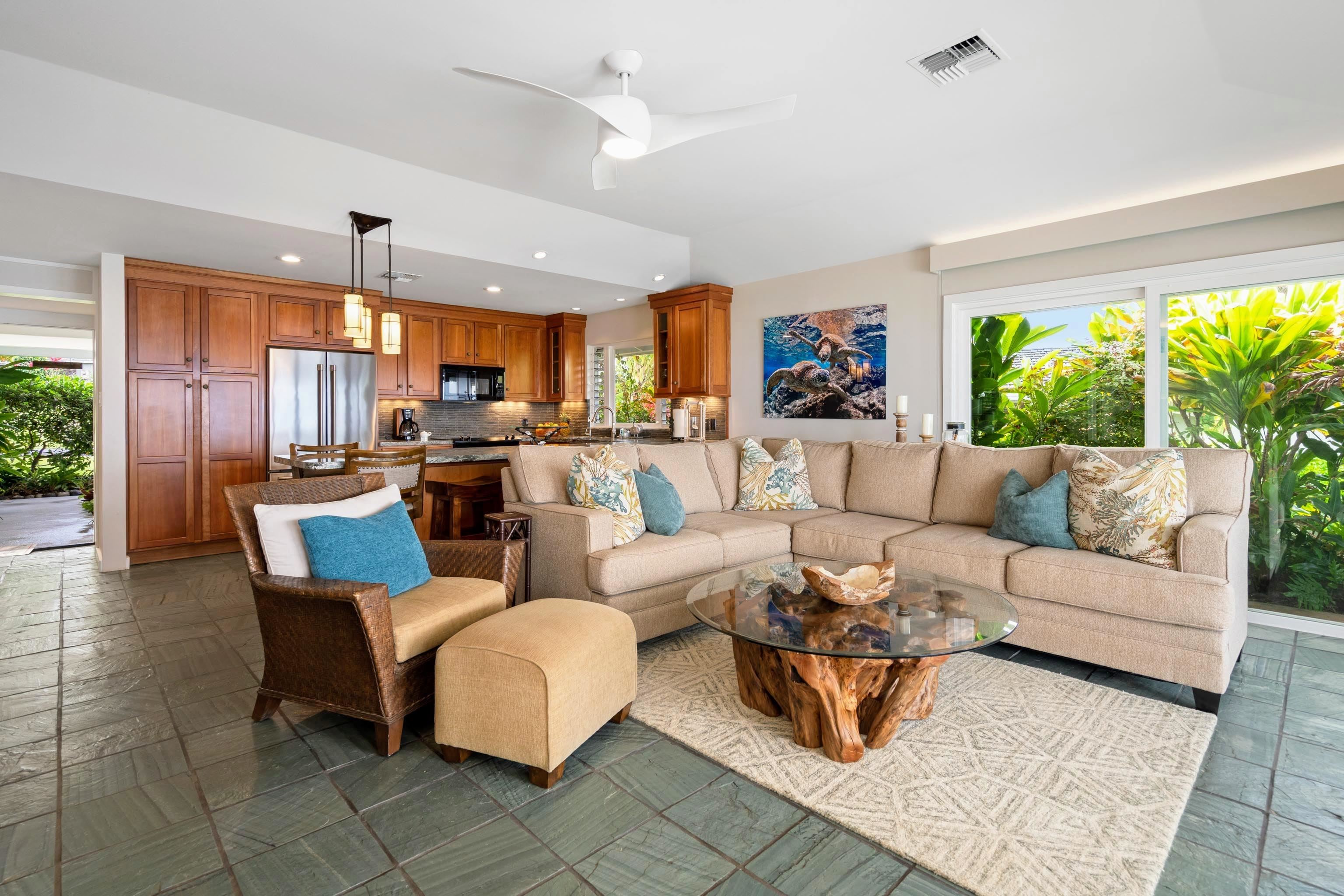 20 Hui Road East, Unit 30 Lahaina, HI 96761 - Photo 8 of 25 a living room with furniture potted plant a fireplace and a large window