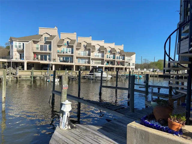 a view of a swimming pool with outdoor seating