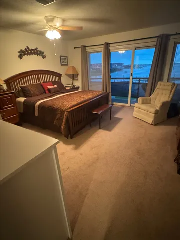 a bedroom with furniture and a window