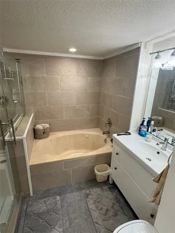 a bathroom with a sink a toilet and bathtub