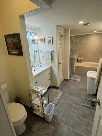 a bathroom with a sink mirror and vanity