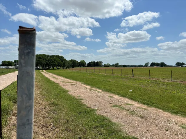 a view of a lake with a big yard