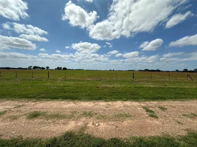 a view of a lake with a big yard