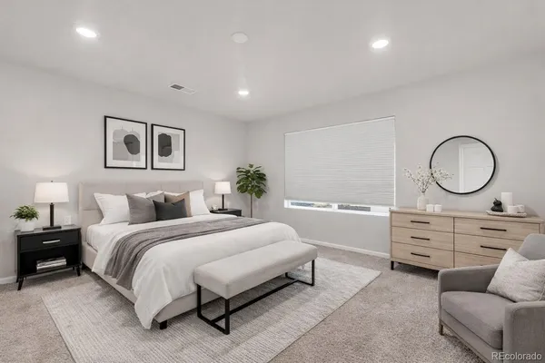 a bedroom with a bed and a dresser