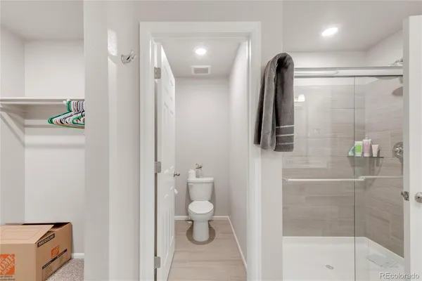 a bathroom with a shower and a toilet