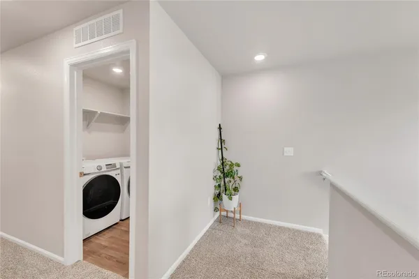 a view of entryway with washer and dryer