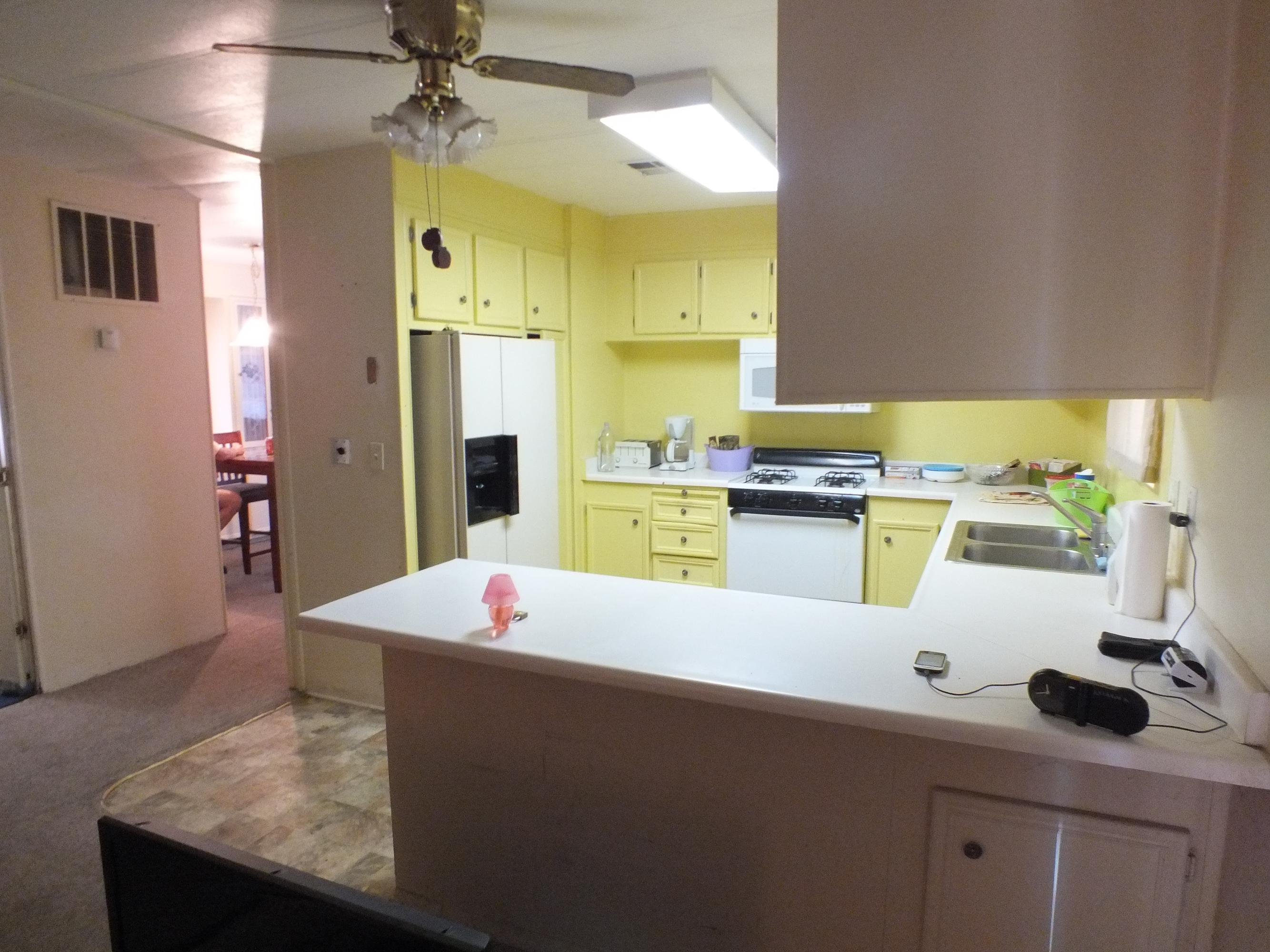 7725 Happy Valley Road, Unit DELUXE Anderson, CA 96007 - Photo 13 of 29 a kitchen with a sink refrigerator and cabinets