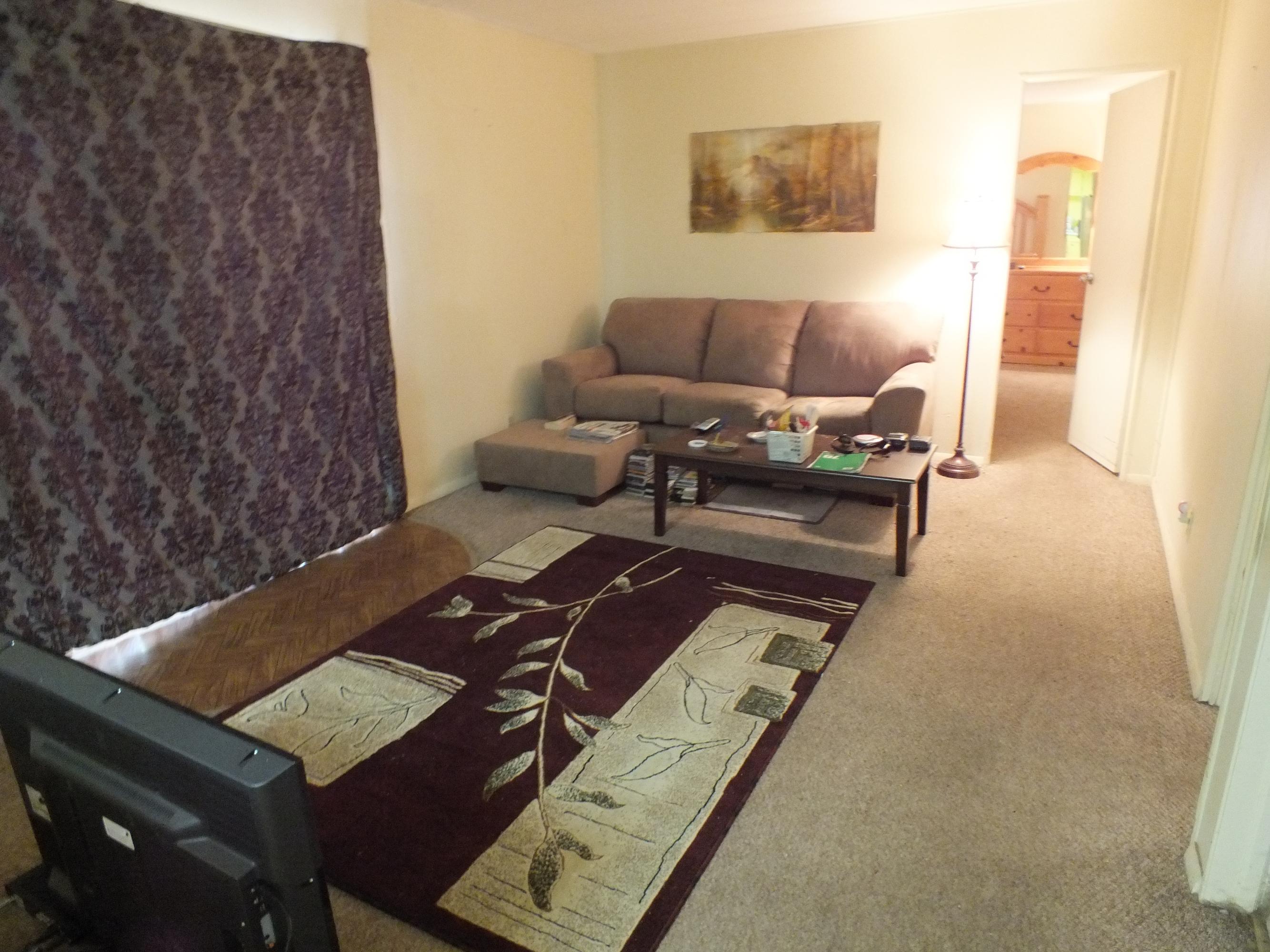 7725 Happy Valley Road, Unit DELUXE Anderson, CA 96007 - Photo 14 of 29 a living room with furniture and a rug